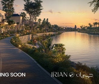 Luxury villas overlooking a waterfront canal at Jirian Compound – sunset view