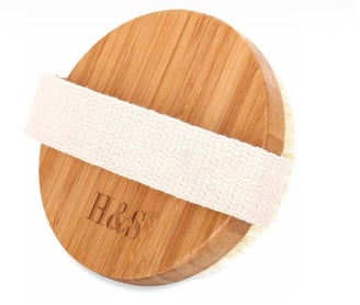a wooden board with a white ribbon around it