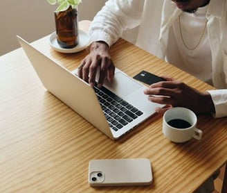 Online Etiquette. Man typing on laptop keyboard.