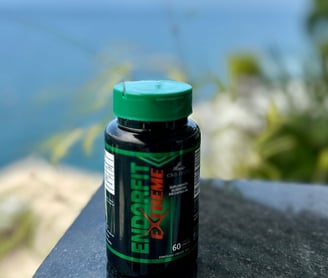 a bottle of green liquid sitting on a table