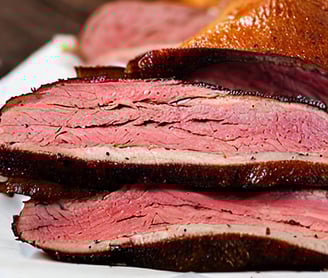 a plate of baked pastrami meat