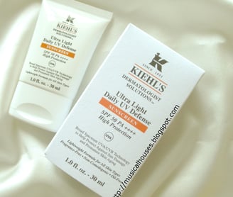 a bottle of Kiehl's skin care products