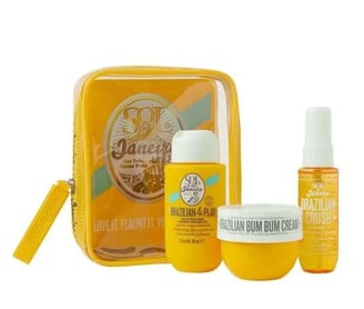 a yellow bag with a small bag of cream and a bottle of cream