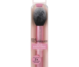 a pink makeup brush with a brush and a brush