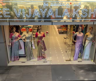 Elegant Sree Vijayalakshmi Silks Jayanagar store front showcasing premium silk sarees for weddings.
