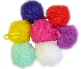 a bunch of colored balls of soap on a white background