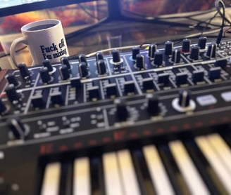 MiniBrute 2 On Desk with Fuck Off I'm Mixing Mug