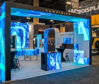 a booth with a blue and white display case