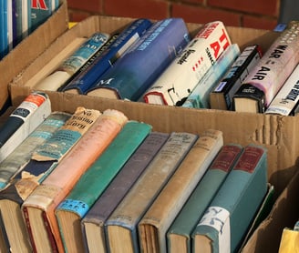 series of second-hand books in a box