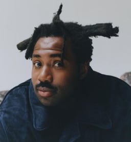 a man with dreadlocks and dreadlocks on his head