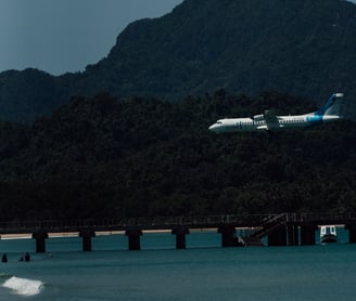 a plane taking off from a beach