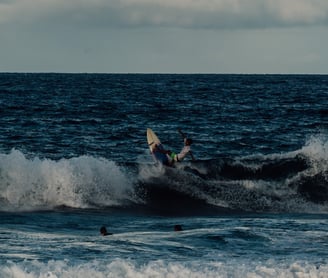 a person surfing on a wave in the ocean