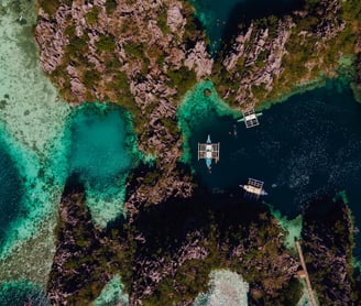 a couple of boats are in the water