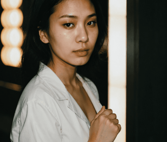 a woman in a white shirt and black pants
