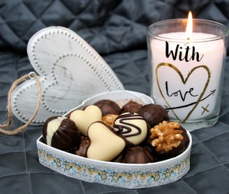 a candle with a candle and a candle in a box