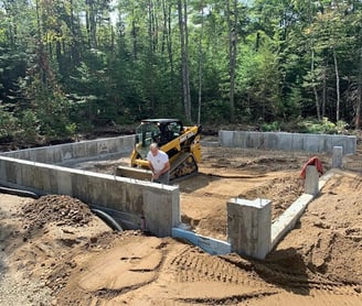 a construction worker is working on a foundation