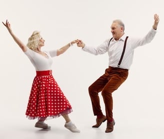 a man and woman dancing in a dance pose