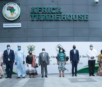 a group of people standing in front of a building