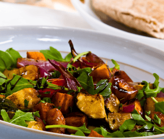 a bowl of balsamic roasted vegetables and bread