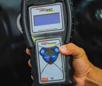 a person holding a cell phone in their hand