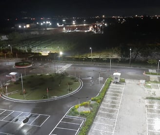 a parking lot with a parking lot and a lot of parking spaces