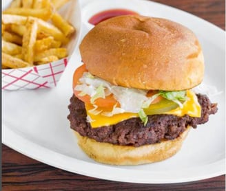 old-fashioned burger, fresh fries on the side, hand crafted patty.