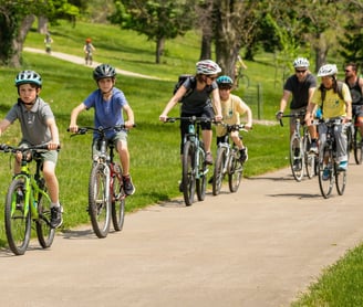 Woman leading group of people on bikes