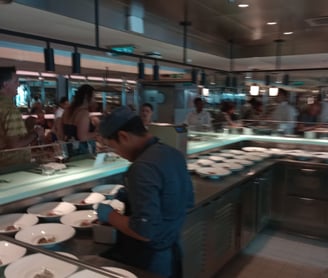 a man is standing in front of a counter top