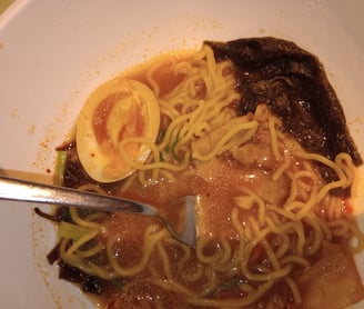 a bowl of noodles with noodles and noodles
