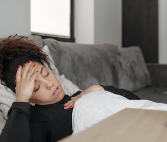sick women lying on bed