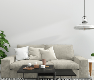 a room with Creem color sofa and table and lamp