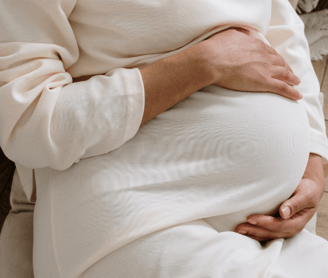 a pregnant women wearing white t-shirt