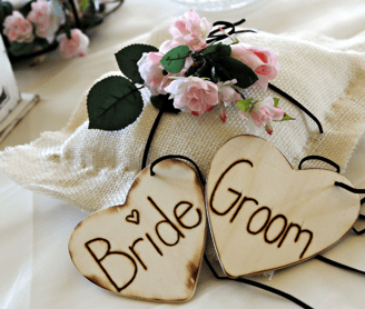 bride and groom is written on the wooden piece