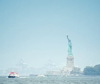 Staten Island ferry sailing past the statue of liberty