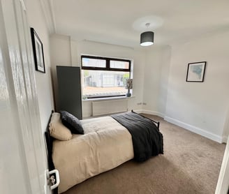 a bedroom with a bed and a wardrobe
