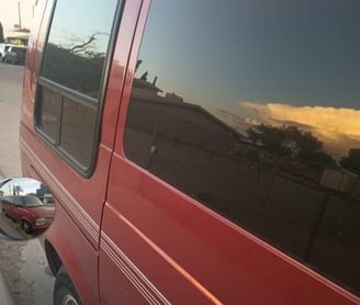 a van parked on the side of a street