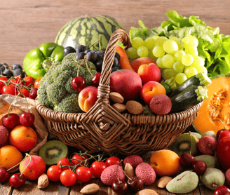 a basket of fruits and vegetables on a wooden table