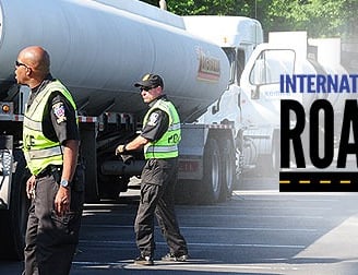 police dot officers inspecting truck