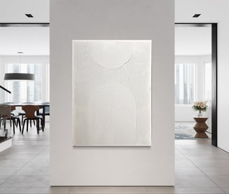 a large white wall with a painting on it