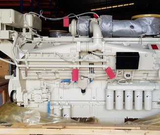 a large white engine on a wooden table