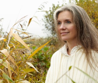 a woman in a white sweater and a white sweater