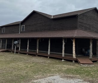 a large house with a brown roof and a brown roof
