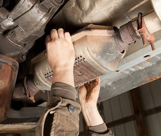 Scrap Yard Near Me Catalytic Converter being removed from car