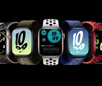 a group of four different colored apple watch bands