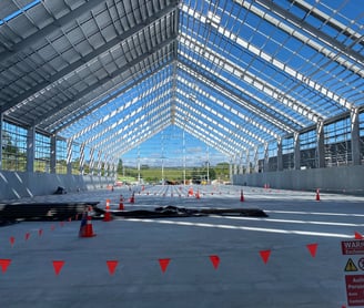 a large open airy structure with a lot of orange cones
