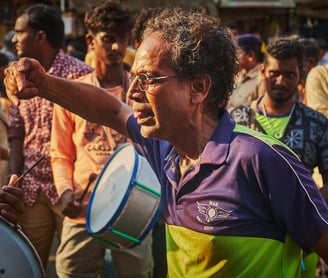 A person dancing to drums in panguni festival at Mylapore, Chennai
