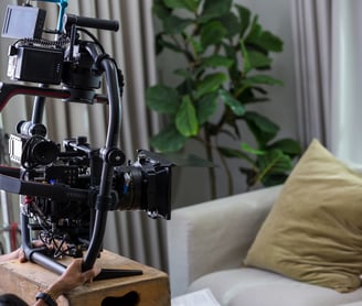 a man is holding a camera and a camera