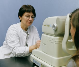 Virtual reality and Longevity - a woman in a white lab coat is looking at a patient
