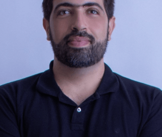 a man with a beard and a beard, wearing a black shirt