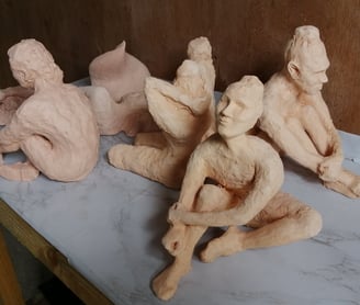 Bisque-fired clay figures